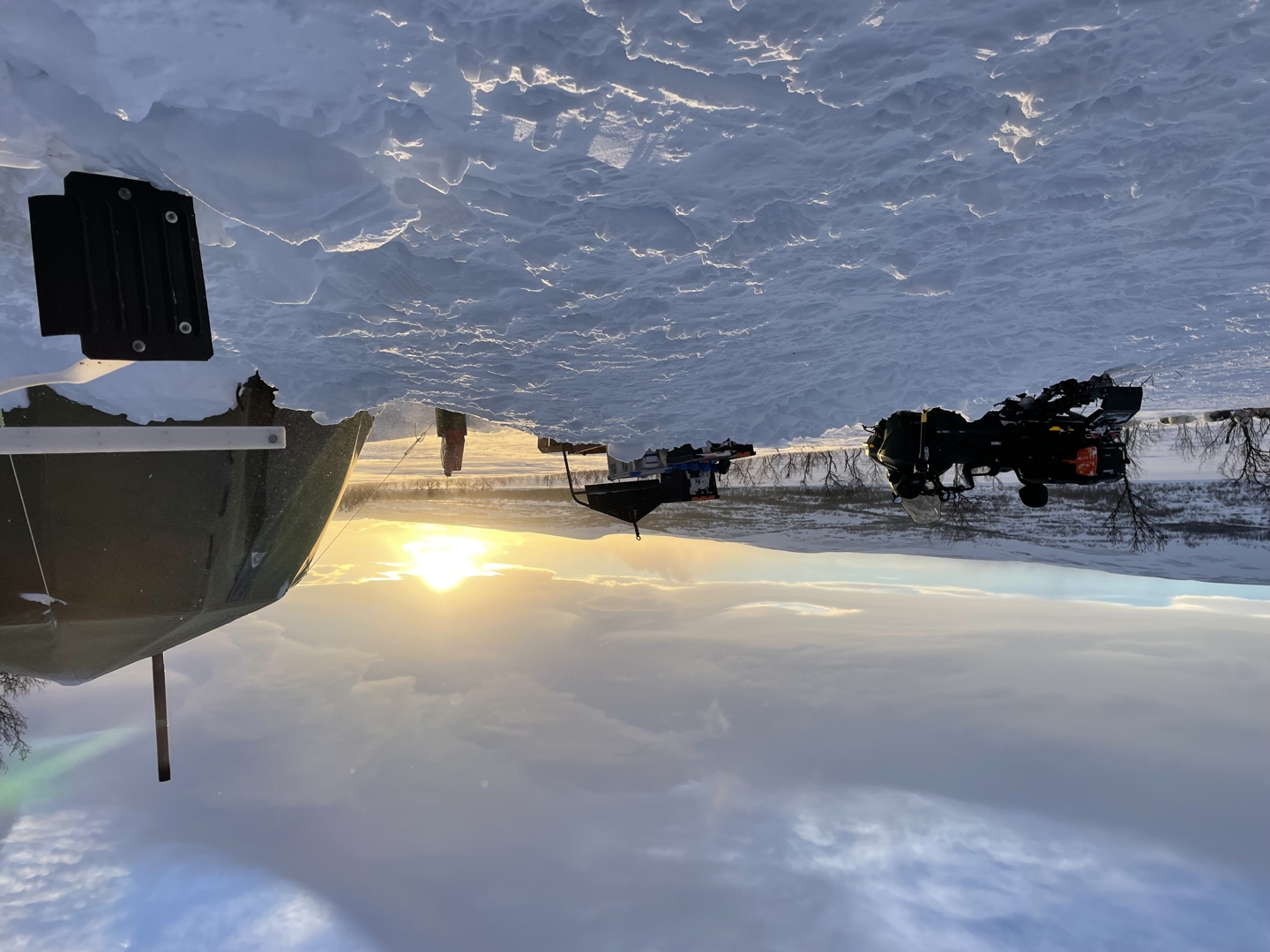 Huskies and sled in Arctic landscape